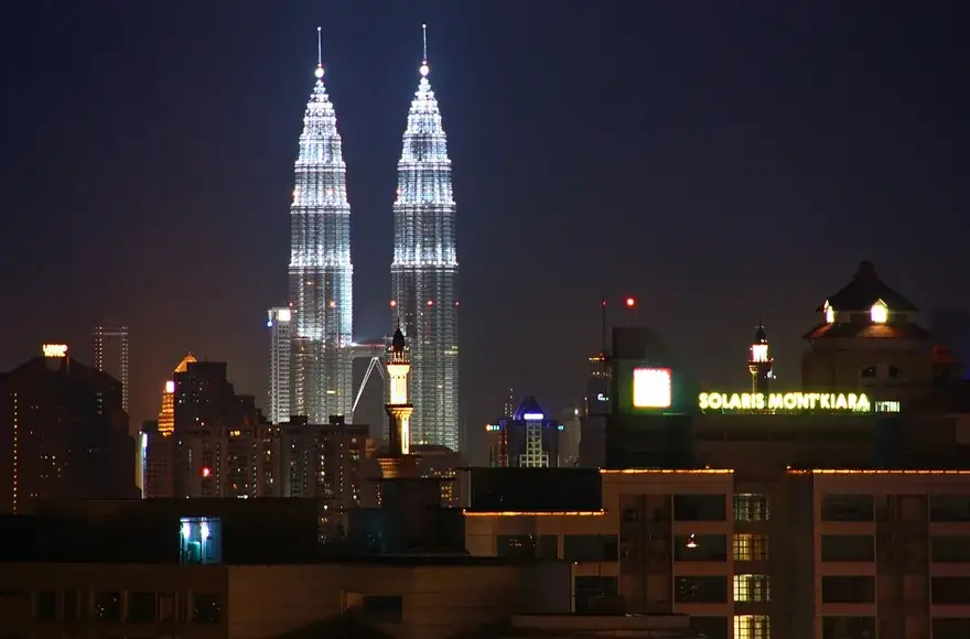 Kuala Lumpur skyline at night, a cross-border limousine destination
